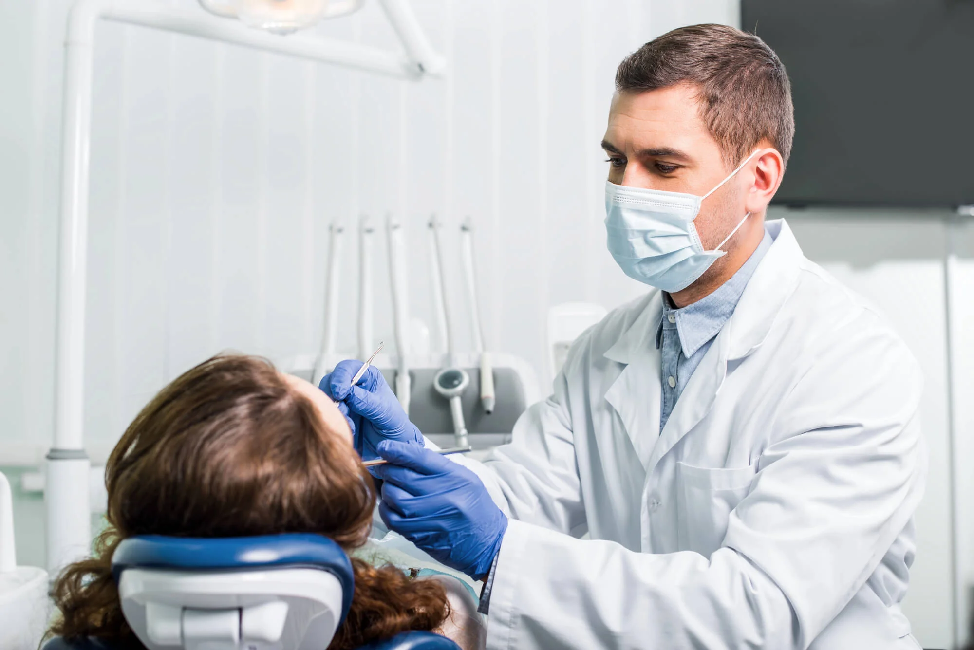 Dentist examining patient in chair Dentist in North Charleston SC