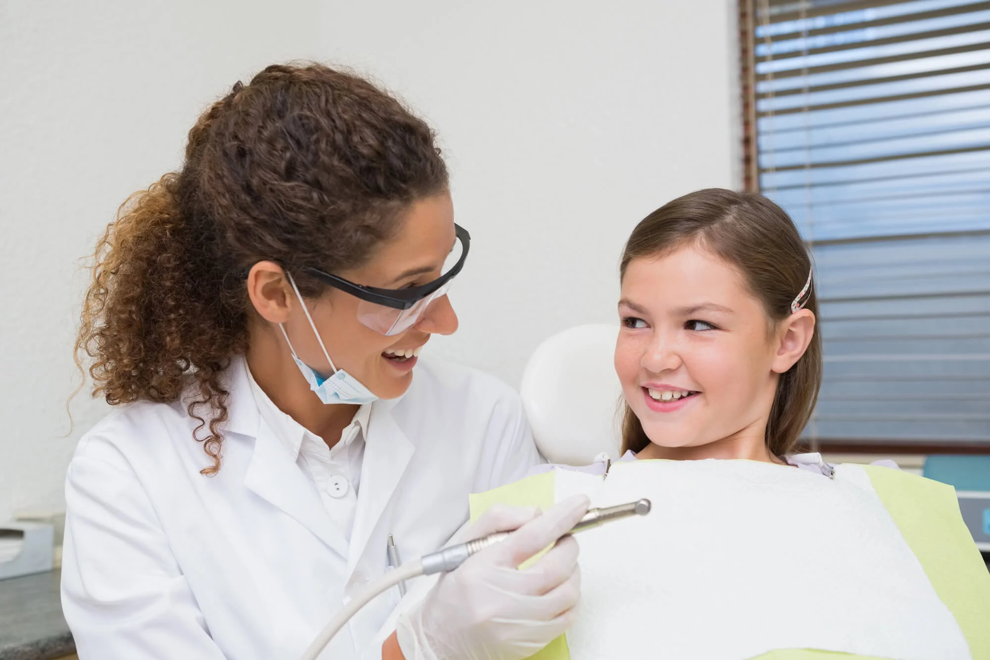 Girl smiling with dentist during visit Family Dentist in North Charleston