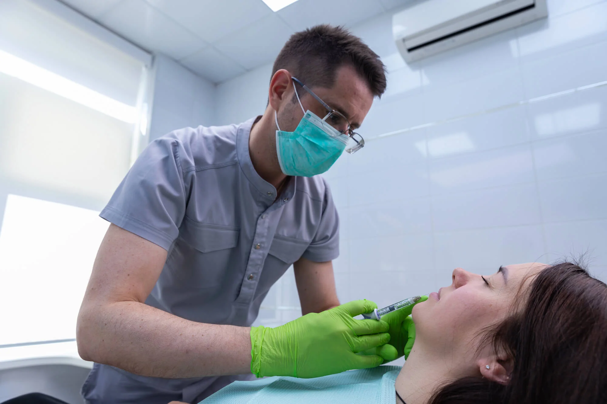 Dentist performing treatment during restorative dentistry