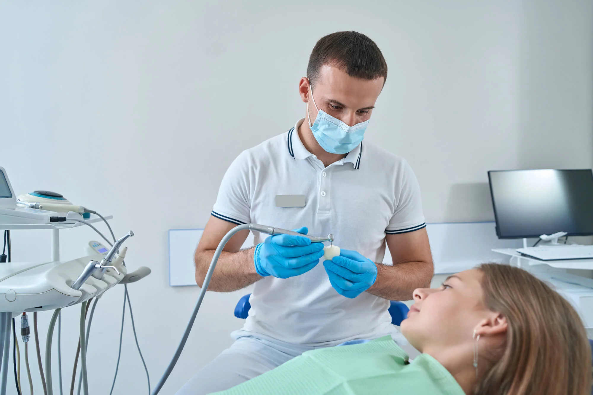 Dentist showing treatment options for restorative dentistry