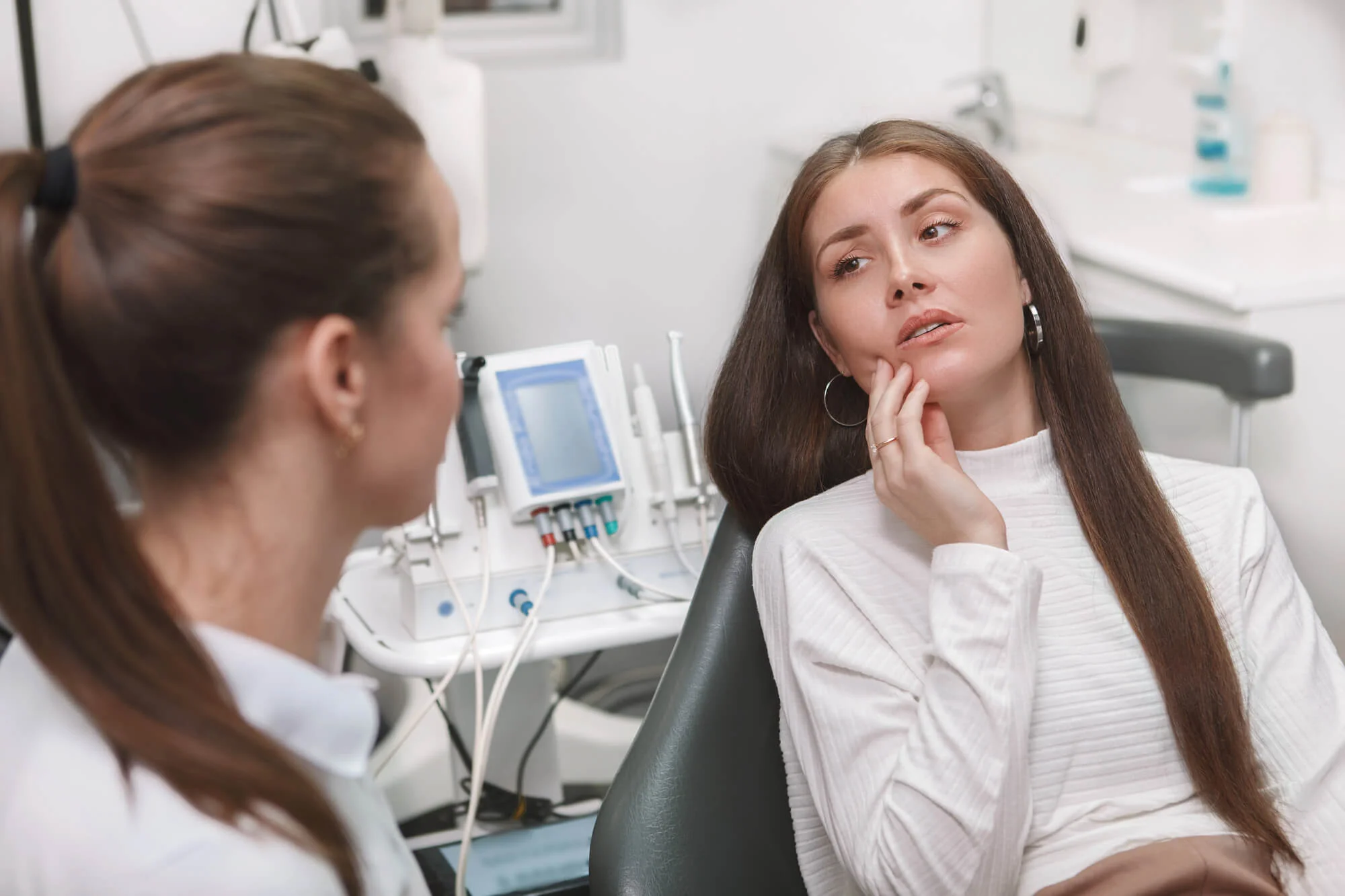 Patient discussing tooth pain with an emergency dentist in Goose Creek