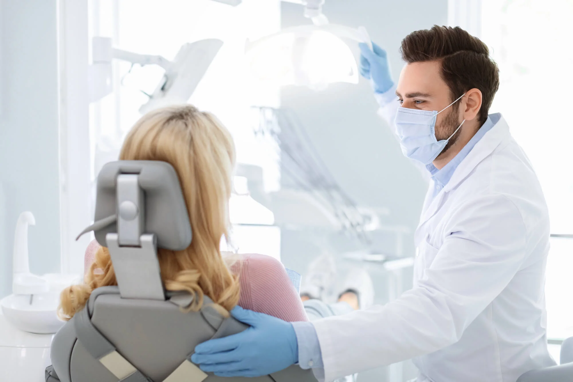 Patient talking with a dentist in Charleston, SC